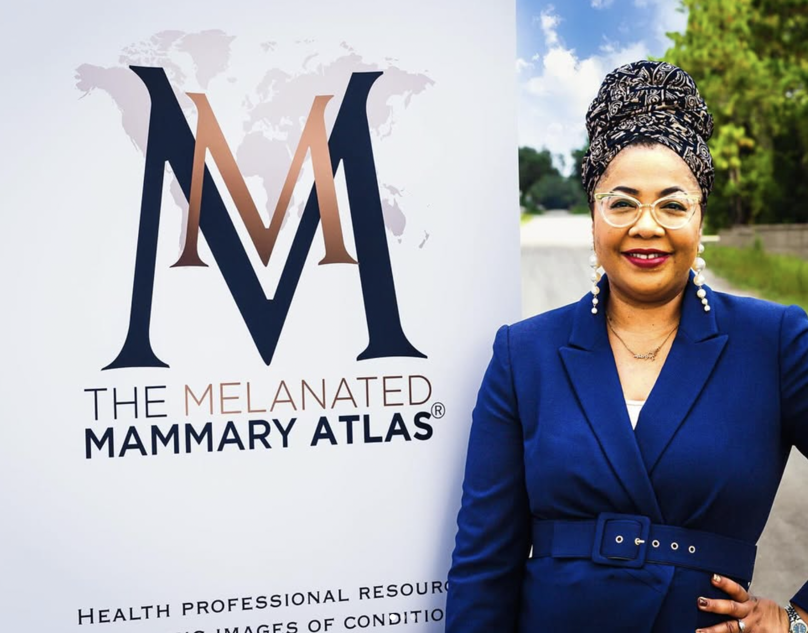 Nekisha Killings standing in front of a semt for the The Melanated Mammay Atlas